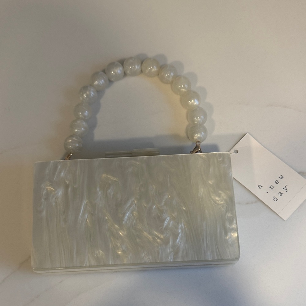A New Day Pearl White Clutch with Beaded Handle
New with tags